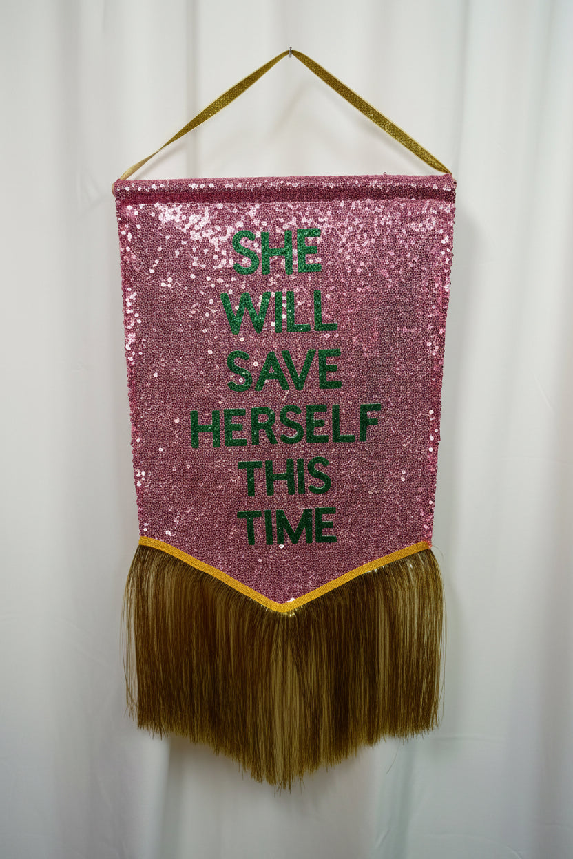 ‘She Will Save Herself This Time’ Banner