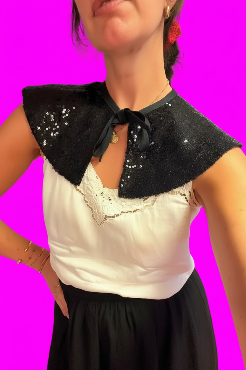 Black sequin capelet.